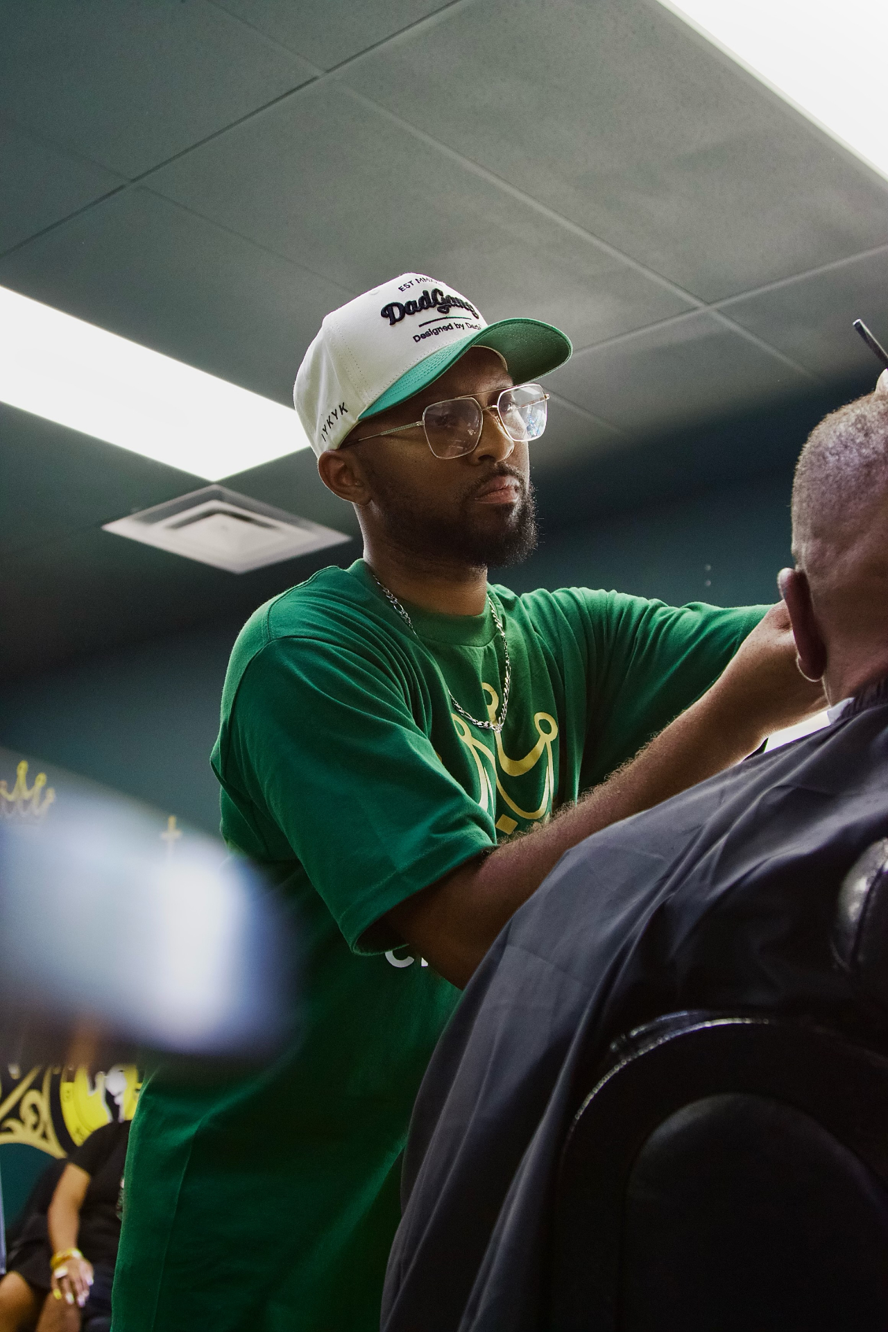 Crown Cuts barber working a cut