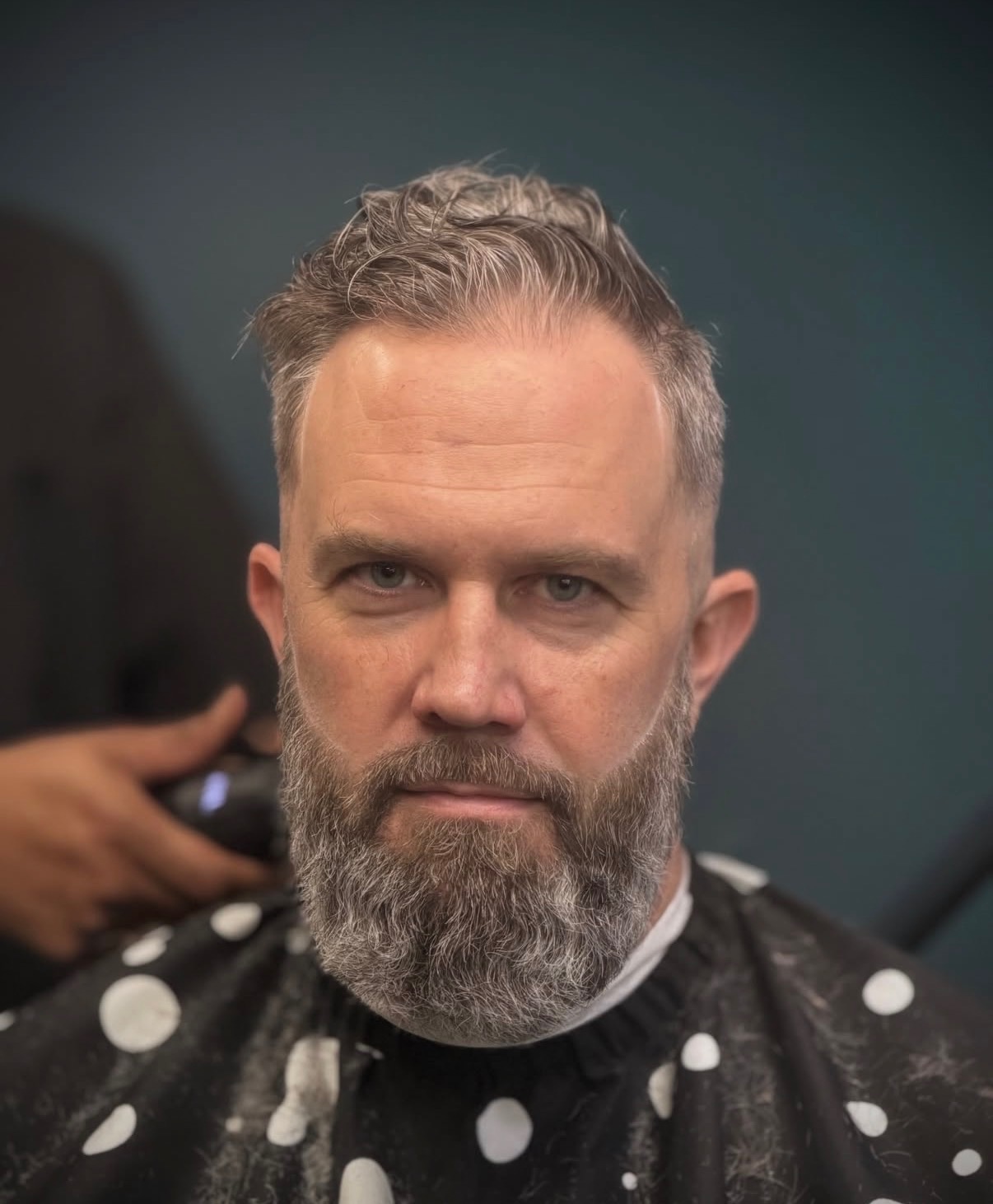 Salt-and-pepper cut with full beard sculpt