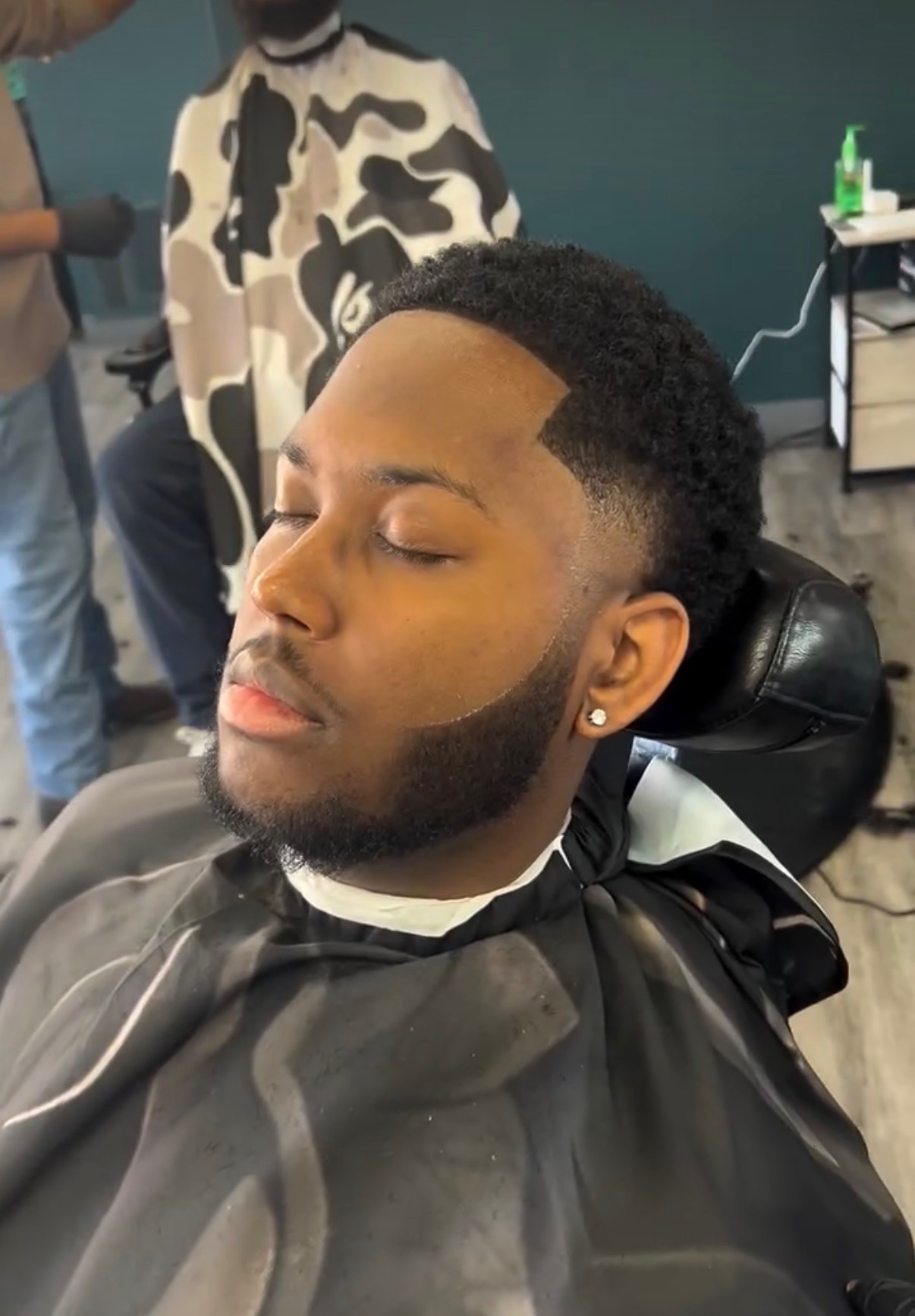 Curly top fade with a sharp line-up